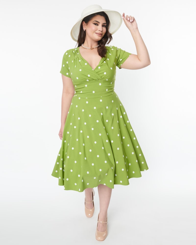 Front of a model wearing a size 5X Unique Vintage Green & White Dot Short Sleeve Delores Swing Dress in Green, Polka Dot by Unique Vintage. | dia_product_style_image_id:287559
